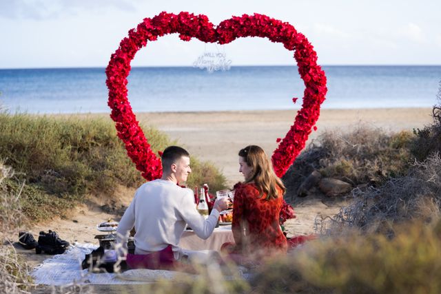 A couple sharing a magical moment at their romantic picnic in Fuerteventura